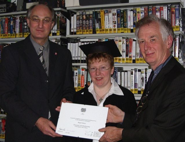 Drs. Cass and Kane conferring life membership of the EVL on former student Birgit Nebert in December 2003.